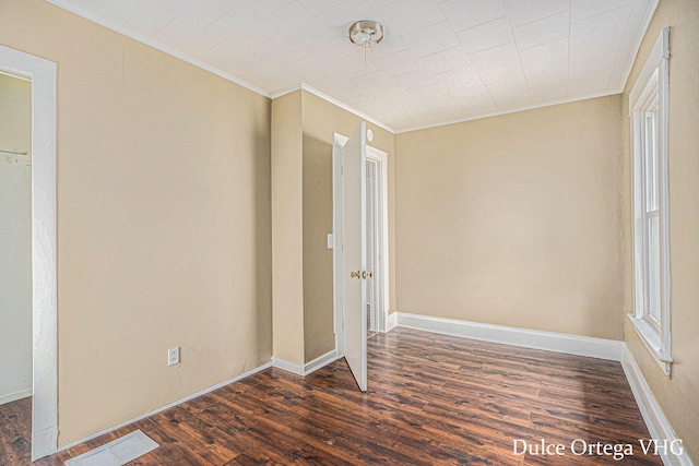2025 Palace Ave SW, Grand Rapids, MI 49507 - unfurnished room with ornamental molding and dark wood-style floors