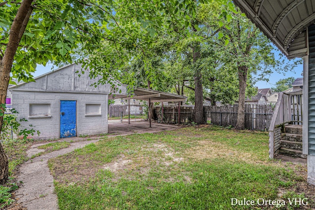 2025 Palace Ave SW, Grand Rapids, MI 49507 - view of yard with a carport and an outdoor structure