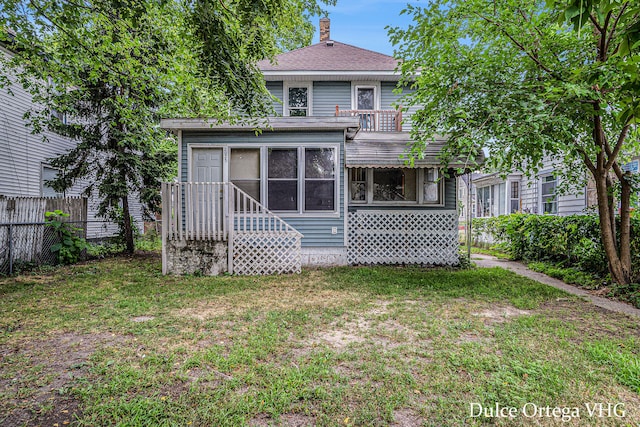 2025 Palace Ave SW, Grand Rapids, MI 49507 - back of property with a chimney and a shingled roof