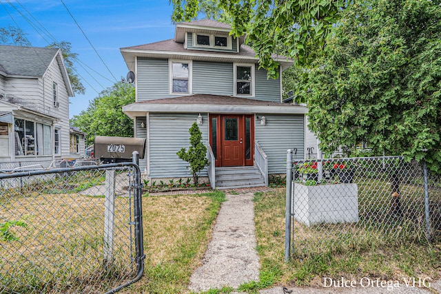2025 Palace Ave SW, Grand Rapids, MI 49507 - traditional style home featuring entry steps, a gate, and a shingled roof