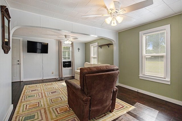 95 W N St, Ionia, MI 48846 - living room featuring a ceiling fan, arched walkways, and hardwood / wood-style floors