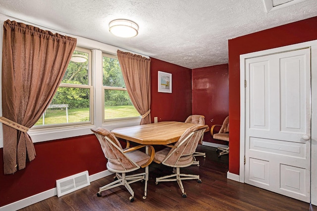 95 W N St, Ionia, MI 48846 - dining space featuring a textured ceiling and wood finished floors