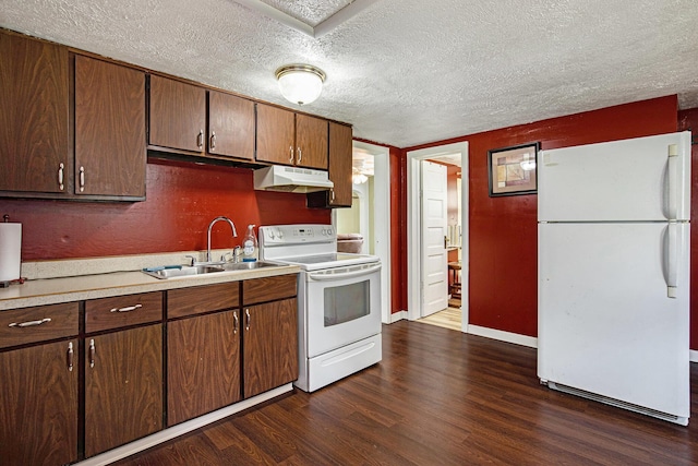 95 W N St, Ionia, MI 48846 - kitchen with white appliances, under cabinet range hood, a textured ceiling, dark wood finished floors, and light countertops
