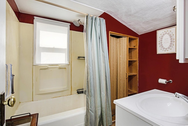 95 W N St, Ionia, MI 48846 - full bathroom featuring shower / tub combo, a textured ceiling, and vaulted ceiling