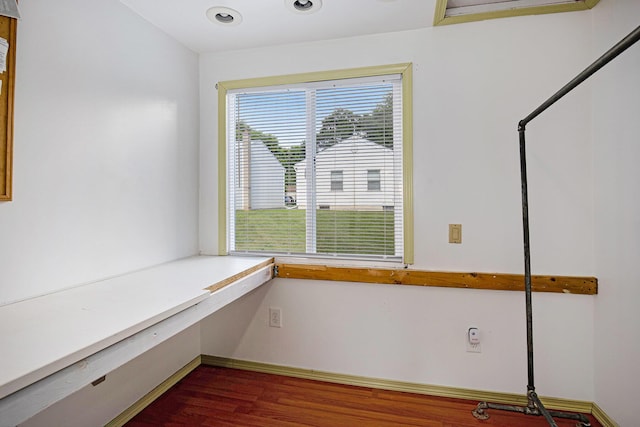 95 W N St, Ionia, MI 48846 - unfurnished office with dark wood-type flooring and baseboards