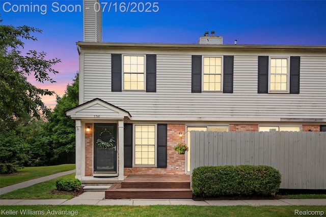 7741 Lake Ridge Dr, Commerce Twp, MI 48327 - view of front of property featuring a chimney and brick siding