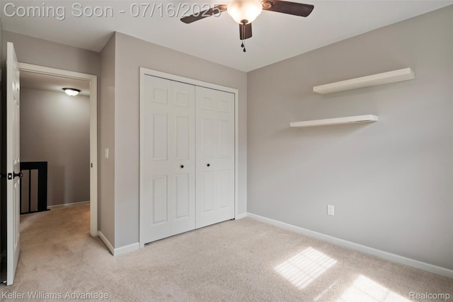 7741 Lake Ridge Dr, Commerce Twp, MI 48327 - unfurnished bedroom featuring light colored carpet, a closet, and a ceiling fan