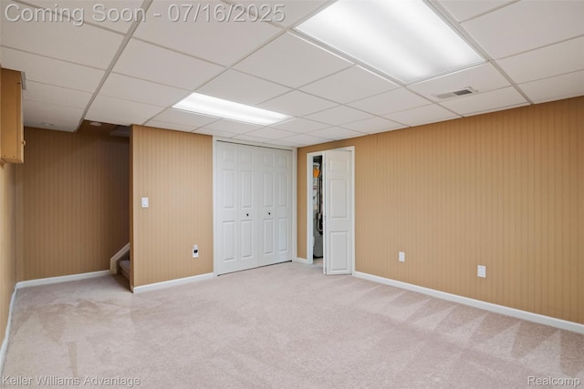 7741 Lake Ridge Dr, Commerce Twp, MI 48327 - finished below grade area featuring carpet flooring, a paneled ceiling, and stairway