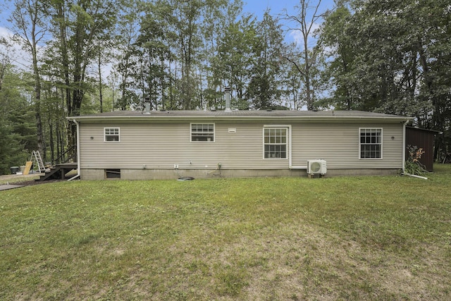 797 Beaver Rd, Bitely, MI 49309 - rear view of house with a lawn