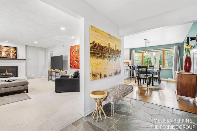 116 Loch Lomond Ave NE, Grand Rapids, MI 49546 - living area with recessed lighting and a brick fireplace