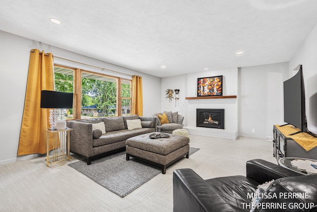 116 Loch Lomond Ave NE, Grand Rapids, MI 49546 - carpeted living area featuring a fireplace and recessed lighting
