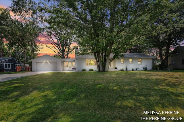116 Loch Lomond Ave NE, Grand Rapids, MI 49546 - ranch-style house with driveway, an attached garage, and a lawn