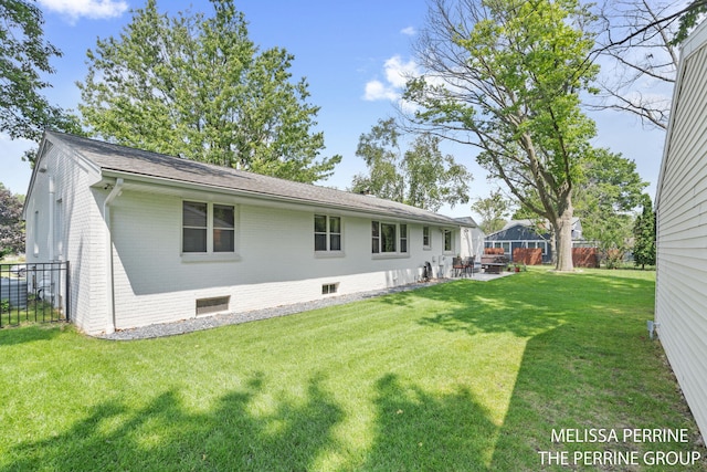 116 Loch Lomond Ave NE, Grand Rapids, MI 49546 - rear view of property with brick siding