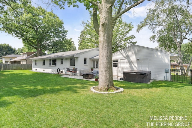116 Loch Lomond Ave NE, Grand Rapids, MI 49546 - back of house featuring a hot tub, a patio, and a fenced backyard