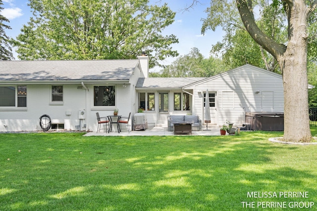 116 Loch Lomond Ave NE, Grand Rapids, MI 49546 - back of property featuring a hot tub, a patio, a chimney, and a lawn