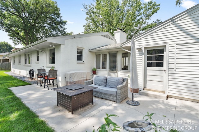116 Loch Lomond Ave NE, Grand Rapids, MI 49546 - view of patio with an outdoor living space with a fire pit