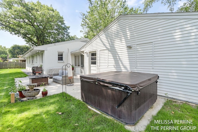 116 Loch Lomond Ave NE, Grand Rapids, MI 49546 - rear view of property featuring a hot tub and a patio