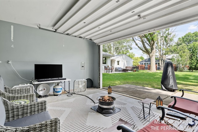 116 Loch Lomond Ave NE, Grand Rapids, MI 49546 - view of patio featuring a fire pit