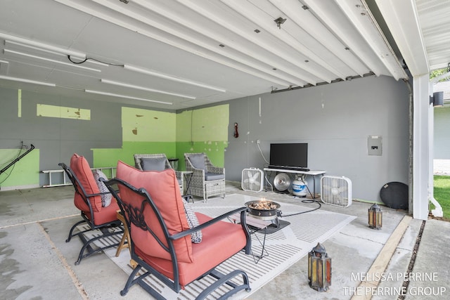 116 Loch Lomond Ave NE, Grand Rapids, MI 49546 - living room featuring unfinished concrete floors and a garage