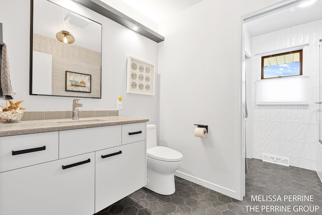 116 Loch Lomond Ave NE, Grand Rapids, MI 49546 - full bath with vanity, tiled shower, and tile patterned flooring