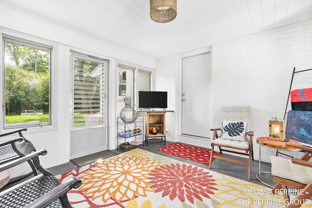 116 Loch Lomond Ave NE, Grand Rapids, MI 49546 - living area with wood ceiling and brick wall