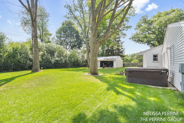 116 Loch Lomond Ave NE, Grand Rapids, MI 49546 - fenced backyard with a hot tub and an outdoor structure