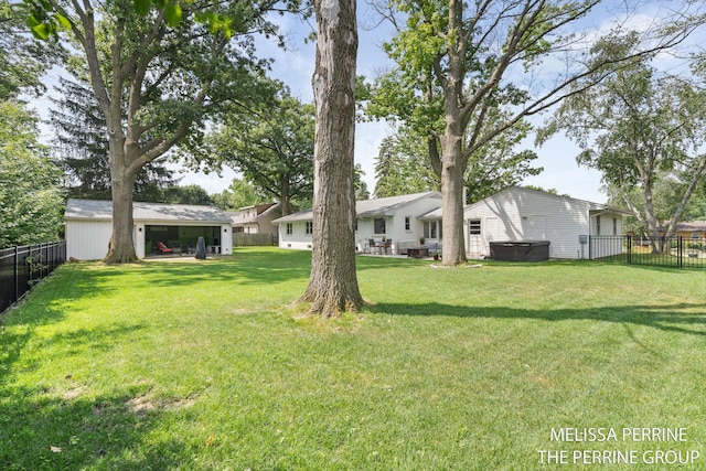 116 Loch Lomond Ave NE, Grand Rapids, MI 49546 - fenced backyard with a hot tub