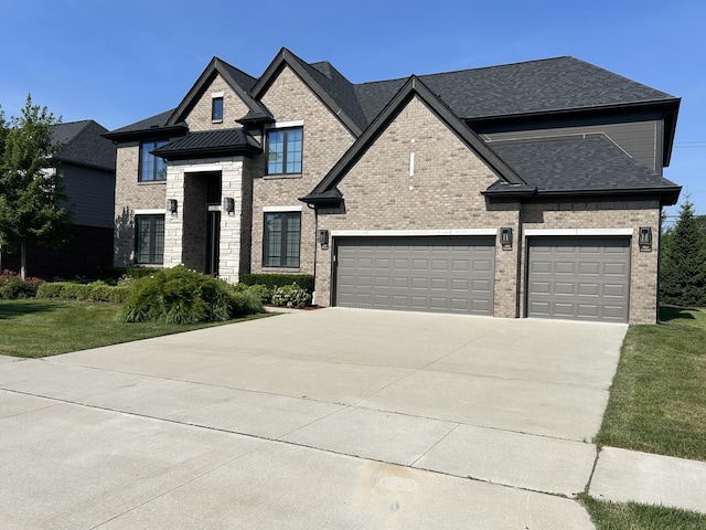 3909 Sandpiper Dr, Troy, MI 48083 - french country home with brick siding, driveway, a front lawn, and roof with shingles