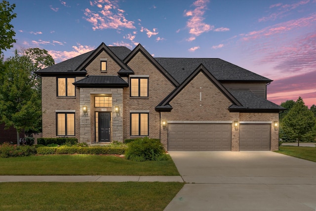 3909 Sandpiper Dr, Troy, MI 48083 - french country inspired facade featuring concrete driveway, brick siding, a lawn, an attached garage, and a shingled roof