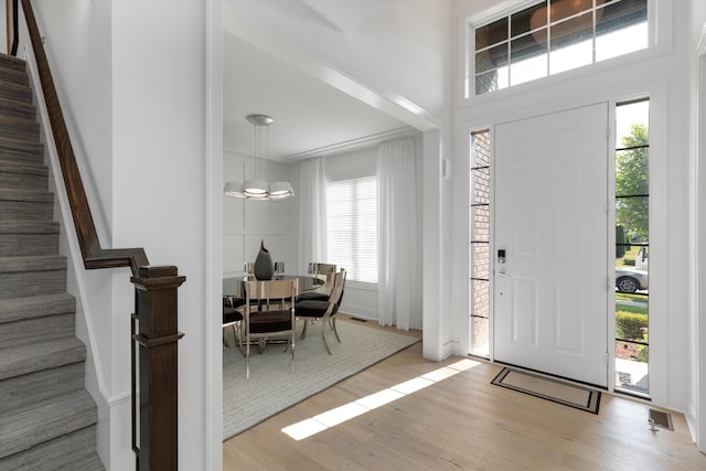 3909 Sandpiper Dr, Troy, MI 48083 - foyer featuring wood finished floors, plenty of natural light, and stairs