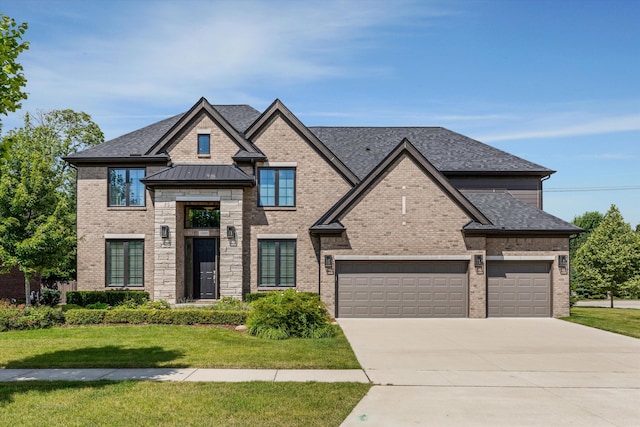 3909 Sandpiper Dr, Troy, MI 48083 - french country style house featuring brick siding, a front lawn, driveway, and a garage