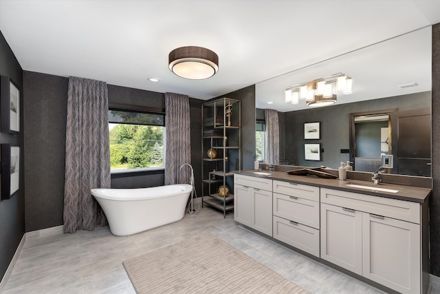 3909 Sandpiper Dr, Troy, MI 48083 - bathroom with double vanity, a soaking tub, and tile patterned floors