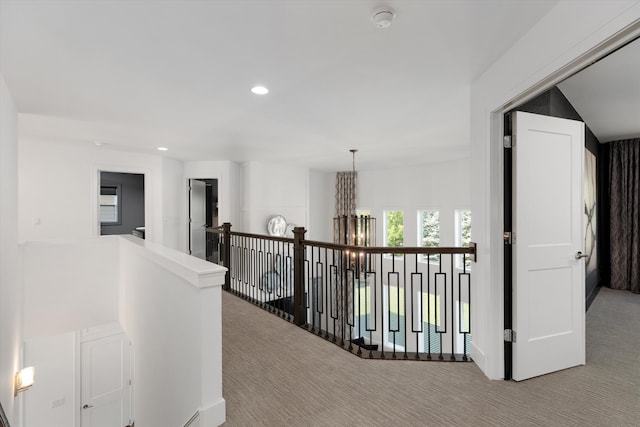 3909 Sandpiper Dr, Troy, MI 48083 - hall with carpet floors, an upstairs landing, a chandelier, and recessed lighting