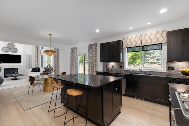 3909 Sandpiper Dr, Troy, MI 48083 - kitchen featuring dishwasher, a center island, tasteful backsplash, a kitchen breakfast bar, and recessed lighting