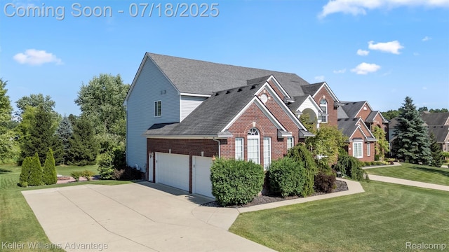 25506 Stanley Ln, South Lyon, MI 48178 - view of front facade with brick siding, concrete driveway, a front lawn, and a shingled roof