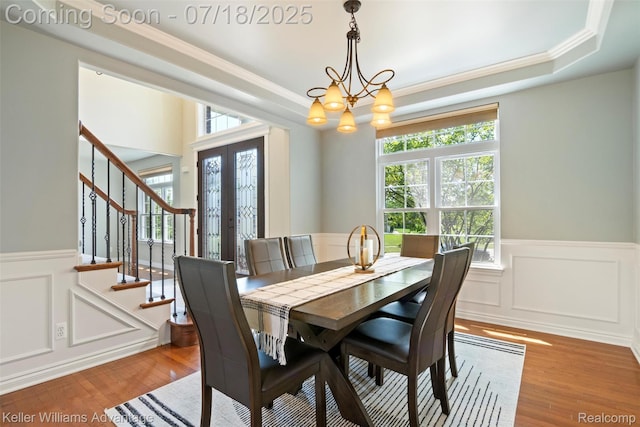 25506 Stanley Ln, South Lyon, MI 48178 - dining area with ornamental molding, stairs, healthy amount of natural light, wainscoting, and a decorative wall