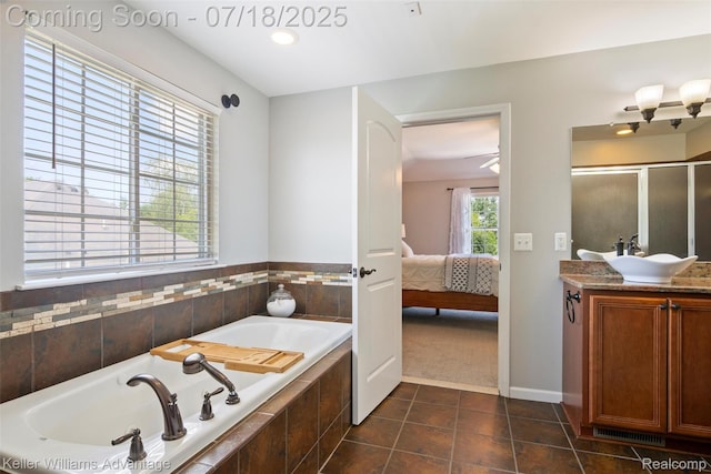 25506 Stanley Ln, South Lyon, MI 48178 - full bathroom with tile patterned flooring, a bath, ensuite bath, vanity, and a stall shower