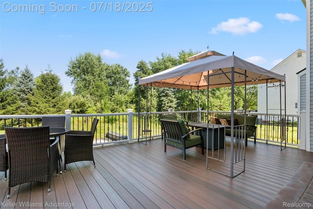 25506 Stanley Ln, South Lyon, MI 48178 - wooden deck featuring outdoor dining space and a gazebo