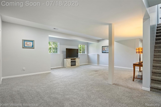 25506 Stanley Ln, South Lyon, MI 48178 - unfurnished living room featuring stairs and carpet floors