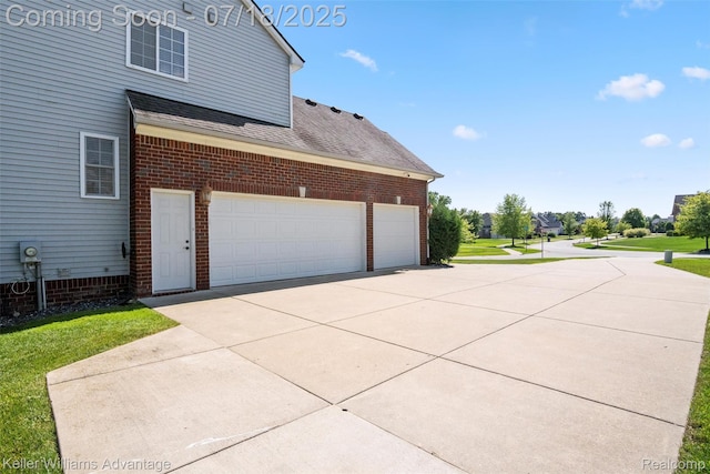 25506 Stanley Ln, South Lyon, MI 48178 - view of side of property featuring brick siding, concrete driveway, a shingled roof, and a yard