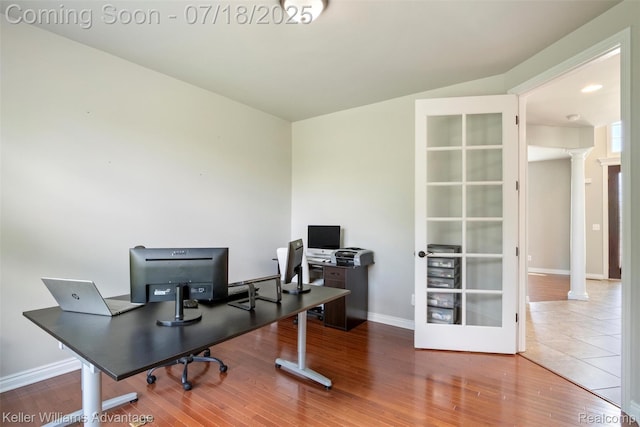 25506 Stanley Ln, South Lyon, MI 48178 - office area with ornate columns, wood finished floors, and french doors