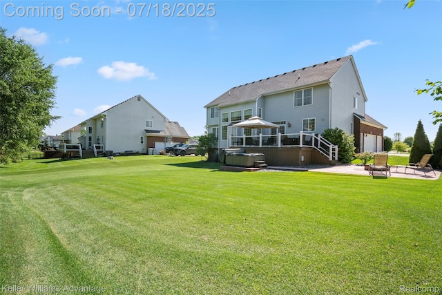 25506 Stanley Ln, South Lyon, MI 48178 - rear view of house featuring a hot tub, a lawn, and a patio area