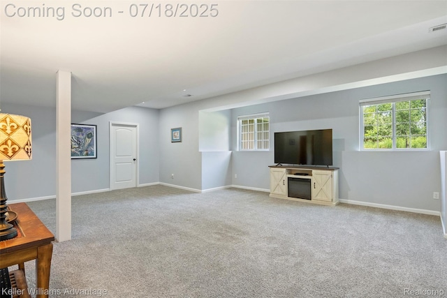 25506 Stanley Ln, South Lyon, MI 48178 - unfurnished living room featuring carpet floors and baseboards