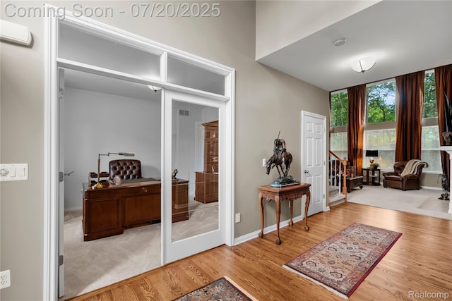 9589 Wellington Ct, Clarkston, MI 48348 - entrance foyer with wood finished floors and french doors