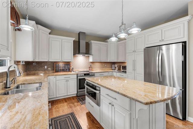 9589 Wellington Ct, Clarkston, MI 48348 - kitchen with appliances with stainless steel finishes, wall chimney exhaust hood, a center island, and decorative backsplash