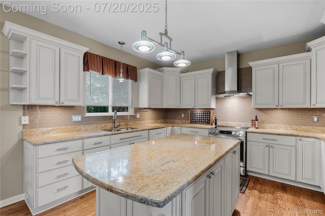 9589 Wellington Ct, Clarkston, MI 48348 - kitchen featuring wall chimney range hood, electric range, light wood finished floors, a kitchen island, and open shelves