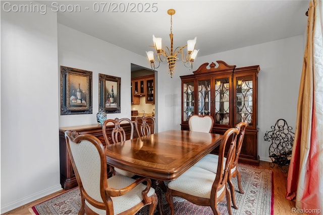 9589 Wellington Ct, Clarkston, MI 48348 - dining room with a chandelier and wood finished floors