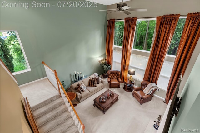 9589 Wellington Ct, Clarkston, MI 48348 - carpeted living area with ceiling fan and plenty of natural light