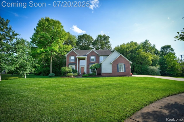 9589 Wellington Ct, Clarkston, MI 48348 - view of front facade featuring a front yard and brick siding