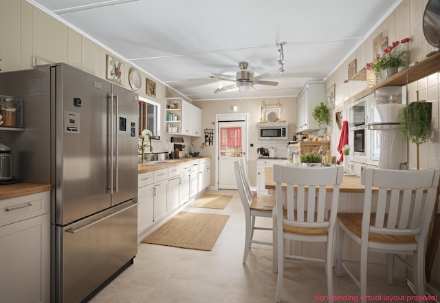 435 Pettibone Dr, Bitely, MI 49309 - kitchen with stainless steel appliances, open shelves, track lighting, ceiling fan, and light floors